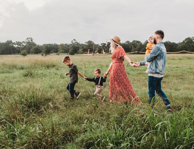 mom dad and kids walking around