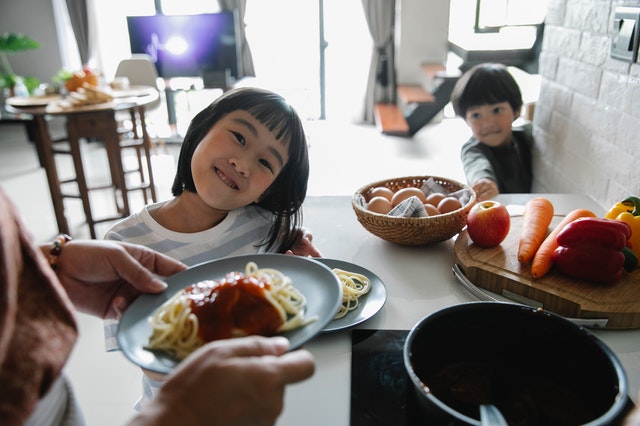 mom prepare food with son and daughter