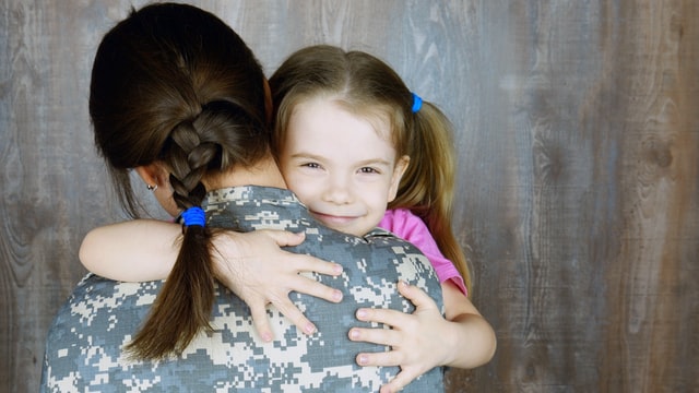 Mom give hugs to her daughter to calming down