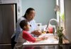 boy doing hand wash with his mom